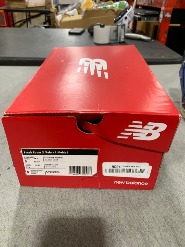 Photo 1 of New Balance Women's Fresh Foam Velo V4 Molded Softball Shoe, White/Gold, 5