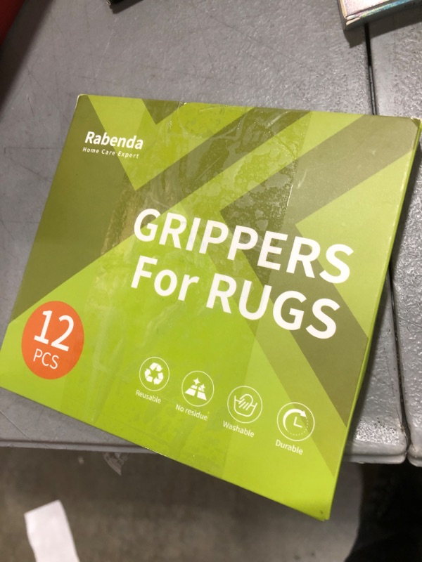 Photo 1 of Rabenda 12 Pcs Rug Tape, Non Slip Rug Pads Grippers for Hardwood Floors and Tiles, Reusable Carpet Tape for Area Rugs, Double-Sided Adhesive Rug Stickers Keep Corners Flat (Black)
