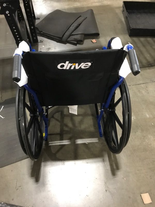 Photo 1 of Drive Medical Blue Streak Lightweight Wheelchair with Swing-Away Footrests and Flip-Back Arms, Portable Folding Wheelchair for Adults and Seniors, 18 Inch Seat