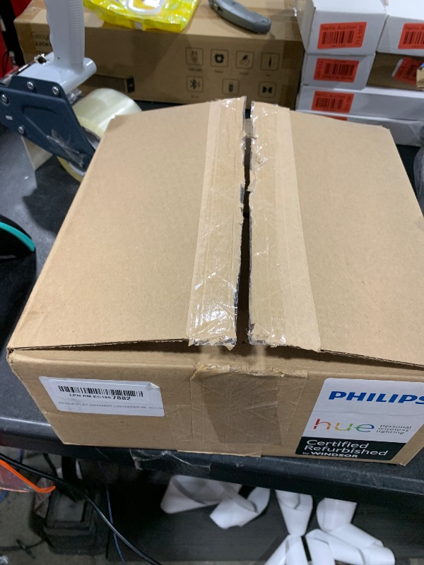 Photo 1 of Philips Hue Gradient LED LightStrip (Sync with TV, Music and Gaming), Hue Hub & Hue Sync Box Required (65Inch) (Renewed)