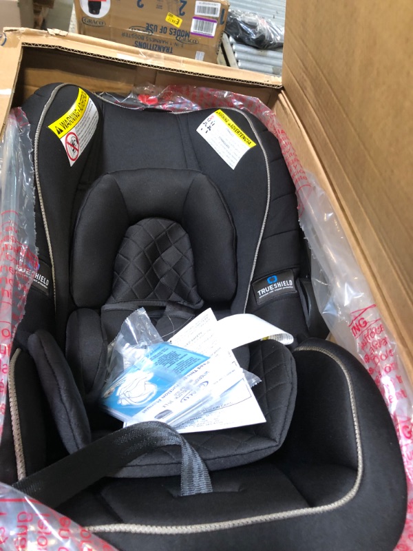 Photo 1 of **OPENED IN NELLIS WAREHOUSE**
Graco SnugRide SnugLock LX Car Seat featuring TrueShield Technology