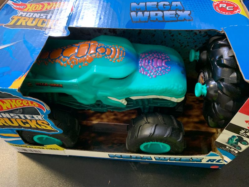 Photo 1 of Hot Wheels Monster Trucks Toy RC, Remote-Control Mega-Wrex in 1:24 Scale with All-Terrain Tires, Performs Wheelies
