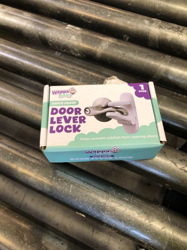 Photo 1 of Door Lever Lock (1 Pack) Prevents Toddlers from Opening Doors. 3.25" L * 1.5" W * 4.5" H Easy One Hand Operation for Adults. Durable ABS with 3M Adhesive Backing. Simple Install, No Tools Needed.