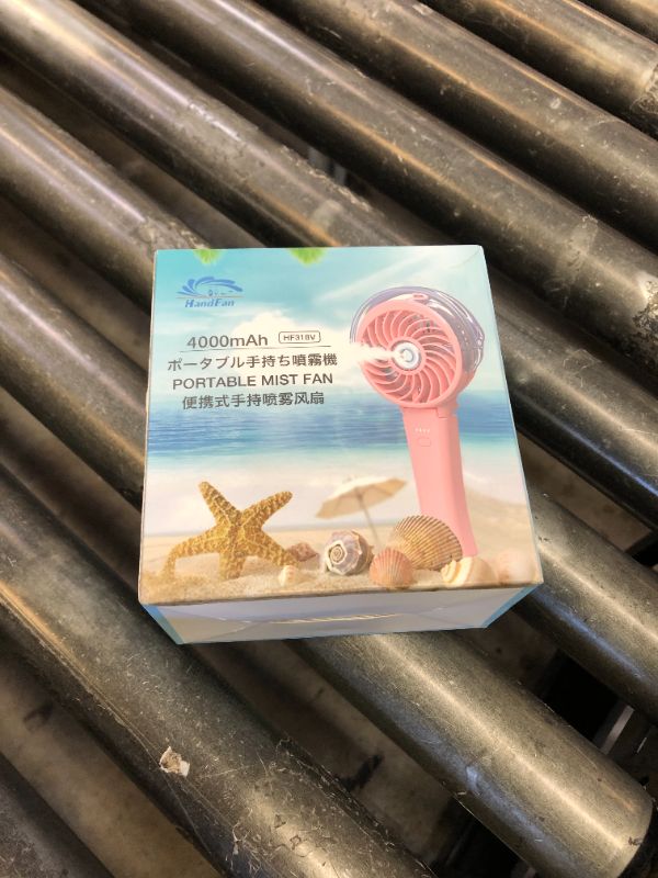Photo 1 of HandFan 4000mAh Handheld Misting Fan, 50ml Water Tank, Rechargeable Personal Mister Fan Portable AC, Spray Water Mist Fans, Foldable Cooling Ice Fans for Beach Travel Outdoors(Pink)