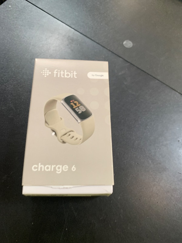 Photo 1 of Fitbit Charge 6 Fitness Tracker with Google apps, Heart Rate on Exercise Equipment, 6-Months Premium Membership Included, GPS, Health Tools and More, Porcelain/Silver, One Size (S & L Bands Included)