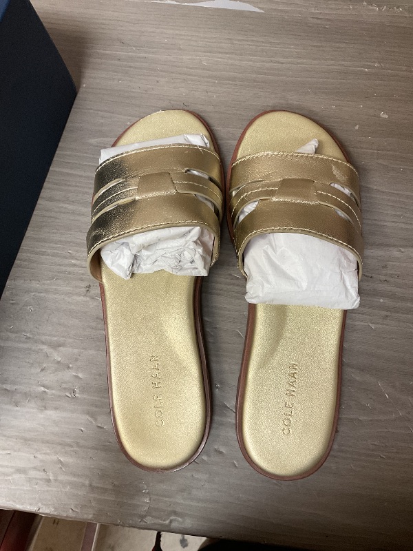 Photo 1 of Cole Haan Women's Flynn Slotted Slides Sandal, Soft Gold LTR, 7.5