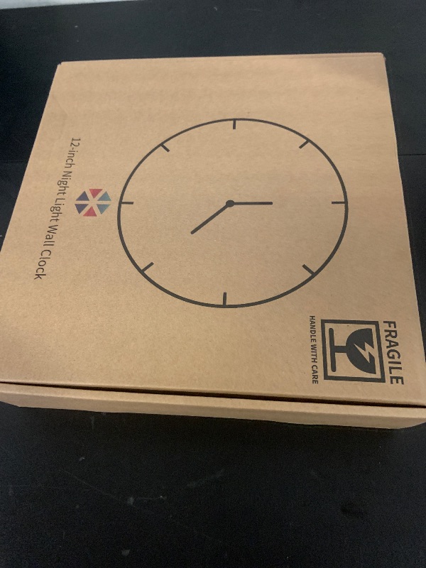 Photo 1 of LOMANDA Night Light Wall Clock, Battery Operated Illuminated Wall Clock for Living Room, Silent Imitation Wood Design with Light, Easy to Read for Bedroom/Kitchen/Home Office, 12Inch