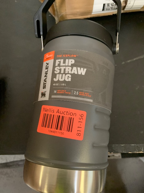 Photo 1 of Stanley IceFlow Flip Straw Jug with Handle 40 oz| Twist On Lid and Flip Up Straw | Leak Resistant for Travel and Sports | Insulated Stainless Steel |BPA-Free |Charcoal