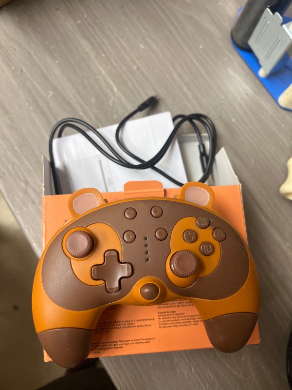 Photo 1 of STOGA Switch Controller, Cute Raccoon Animal Switch Pro Controller for Switch Lite/OLED/PC, Wireless Switch Controller with Wake-Up,Gyro Axis,Turbo and Dual Vibration-Brown