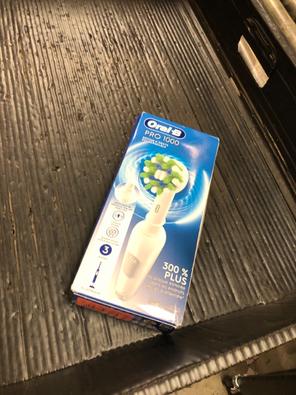 Photo 1 of Oral-B Pro 1000 Rechargeable Electric Toothbrush, White
