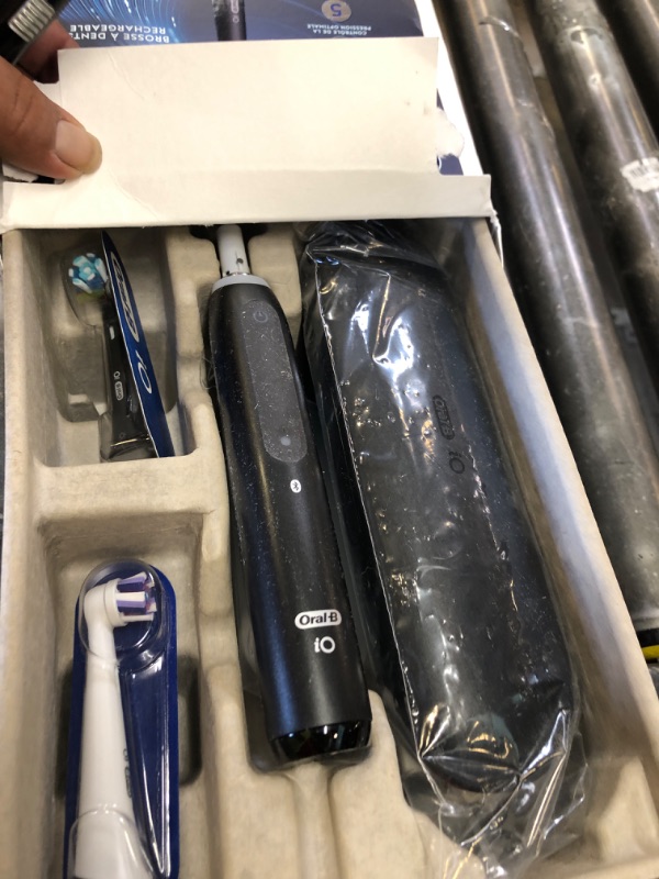 Photo 1 of Oral-B iO Deep Clean + Whiten Rechargeable Electric Toothbrush with Visible Pressure Sensor, 2 Minute Timer, 5 Cleaning Settings, 1 iO5 Limited, 3 Toothbrush Heads, Travel Case & Refill Holder, Black
