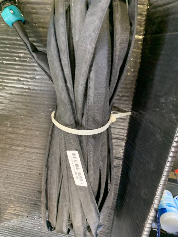 Photo 1 of Hourleey Flat Soaker Hose 50 FT for Garden, 50' Linkable Consistent Drip Irrigation Hose, Leak-free Dual-layer Design Saving 80% Water Garden System Water Hose with Holes