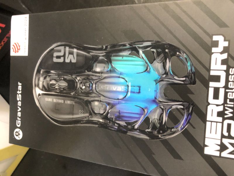 Photo 1 of GravaStar Mercury M2 Wireless Gaming Mouse with 26,000 DPI, PAW3395DM Sensor -79g Lightweight Hollowed-Out Design -5 Programmable Buttons -5 Dynamic Lightsync RGB - Transparent Black
