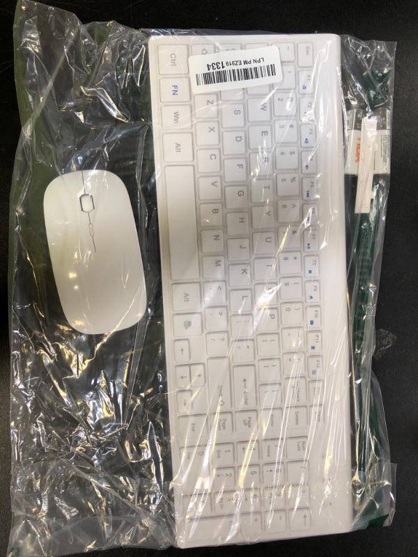 Photo 1 of Wireless Keyboard and Mouse Ultra Slim Combo, TopMate 2.4G Silent Compact USB 2400DPI Mouse and Scissor Switch Keyboard Set with Cover, 2 AA and 2 AAA Batteries, for PC/Laptop/Windows/Mac - White