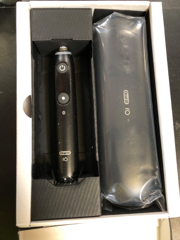 Photo 1 of Oral-B iO Series 10 Rechargeable Electric Toothbrush with Visible Pressure Sensor to Protect Gums, 2 Min Timer, 7 Cleaning Settings, 4 Replacement Toothbrush Heads, and Charging Travel Case, Black