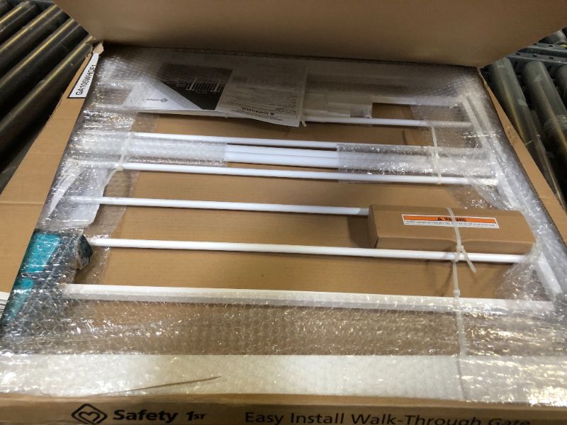 Photo 1 of Safety 1st Easy Install Walk Thru Baby Gate for Doorways, Gate With Door, Dog Gates, Fits 29"-38", Easy Install 28" Tall, White