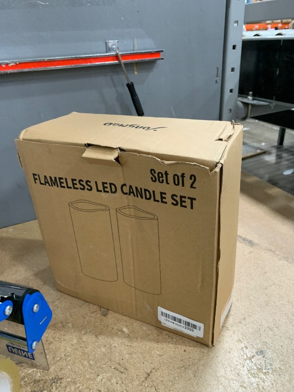 Photo 1 of ****PARTS ONLY***DO NOT TURN ON***Yongmao 10" x 5" Waterproof Outdoor Flameless Candles Battery Operated LED Flickering Pillar Candles with Remote and Timer for Indoor Outdoor Lanterns, Long Lasting, Ivory White Large, Set of 2