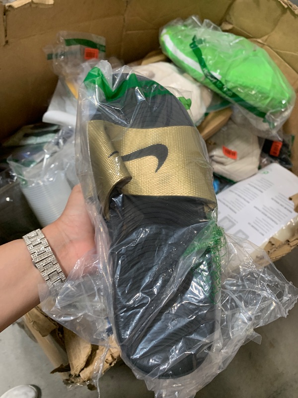 Photo 1 of gold black nike sandals size 10