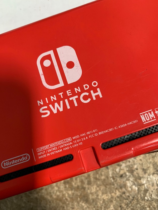 Photo 1 of *WONT POWER ON* Nintendo Switch with Neon Blue and Neon Red Joy?Con V2 (Renewed Premium).