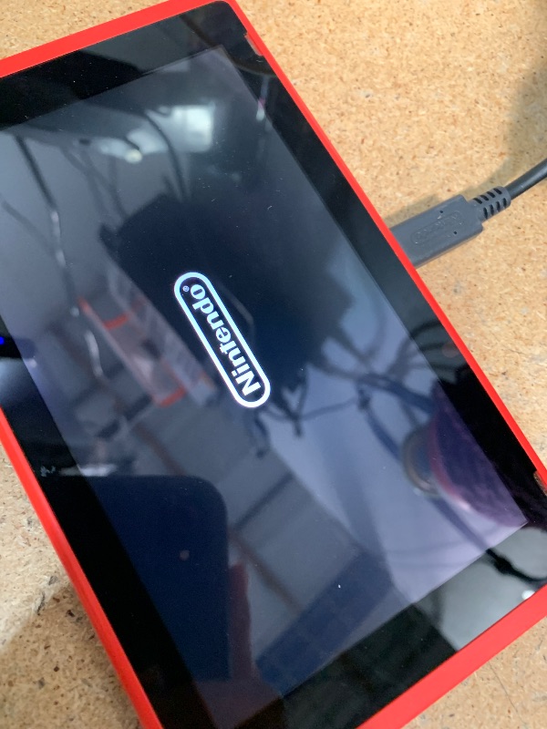 Photo 1 of *WONT POWER ON* Nintendo Switch with Neon Blue and Neon Red Joy?Con V2 (Renewed Premium).