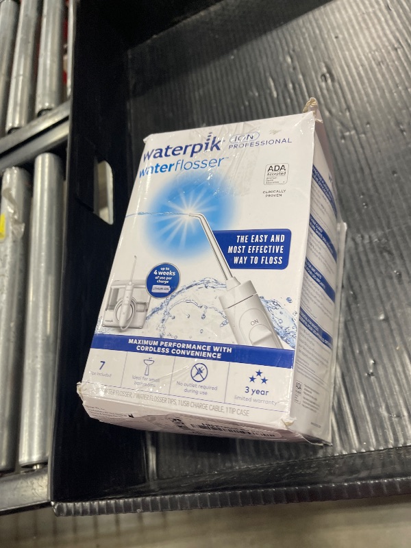Photo 1 of Waterpik ION Professional Water Flosser, Rechargeable and Portable for Teeth, Gums, Braces, 10 Settings, 7 Flossing Tips For Multiple Users And Needs, ADA Accepted, WF-12 White, Packaging May Vary