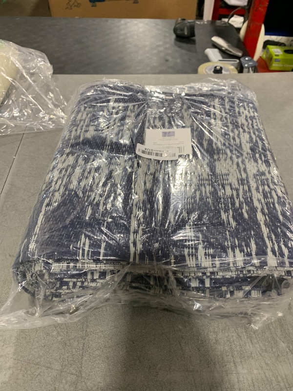 Photo 1 of MontVoo Outdoor Rug Waterproof 5x8 ft Outdoor Carpet Patio Rug Mat Reversible RV Camping Rug Plastic Straw Outside Rug for Balcony Porch Deck Picnic Beach Modern Navy