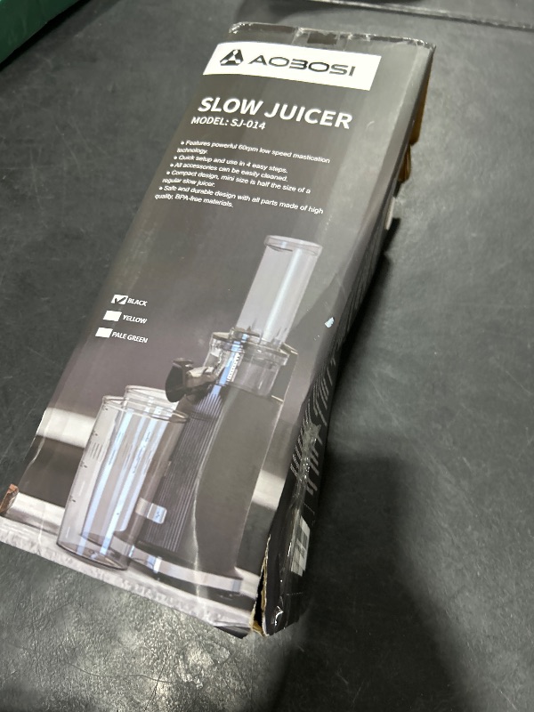 Photo 1 of Aobosi Compact Small Mini Juicer Machines Space-Saving Slow Masticating Juicer with High Juice Yield, Cleaning Brush Included, Small Cold Press Juicer Fit for Travel/Picnic/Office(Black)