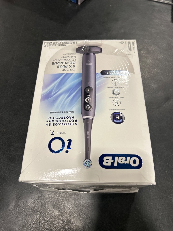 Photo 1 of Oral-B iO Deep Clean + Protect Rechargeable Electric Toothbrush, Black with a iO Series 7 Toothbrush, 2 Replacement Brush Heads, and a Charging Travel Case