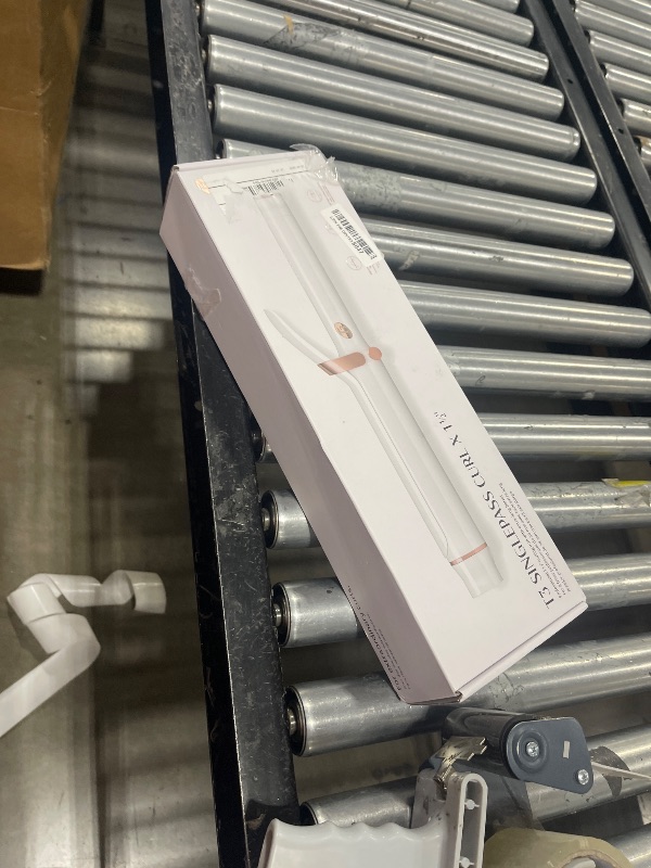 Photo 1 of T3 SinglePass Curl X Extra-Long Barrel Curling Iron with 9 Heat Settings and Ceramic Barrel for Fast Styling and Lasting Results on All Hair Types