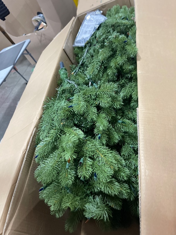 Photo 1 of National Tree Company Pre-Lit 'Feel Real' Artificial Full Downswept Christmas Tree, Green, Douglas Fir, Dual Color LED Lights, 7.5 feet