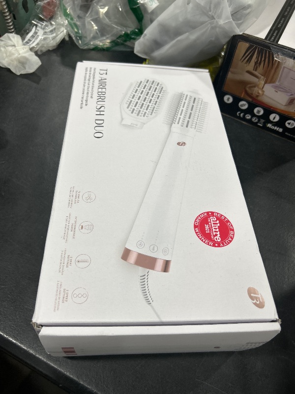 Photo 1 of "T3 AireBrush Duo Interchangeable Hot Air Blow Dry Brush with Two Attachments ? Includes 15 Heat and Speed Combinations, T3 IonFlow Technology, Volume Booster Switch, Lock-in Cool Shot"