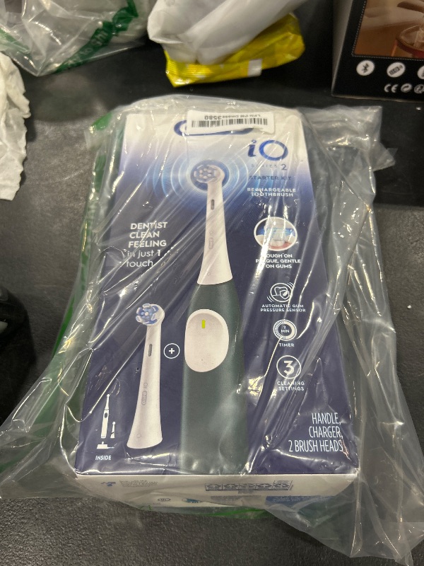 Photo 1 of Oral-B iO Series 2 Rechargeable Electric Powered Toothbrush Starter Kit, Forest Green with 2 Brush Heads - Automatic Pressure Sensor to Protect Gums - 3 Modes - 2 Min Timer