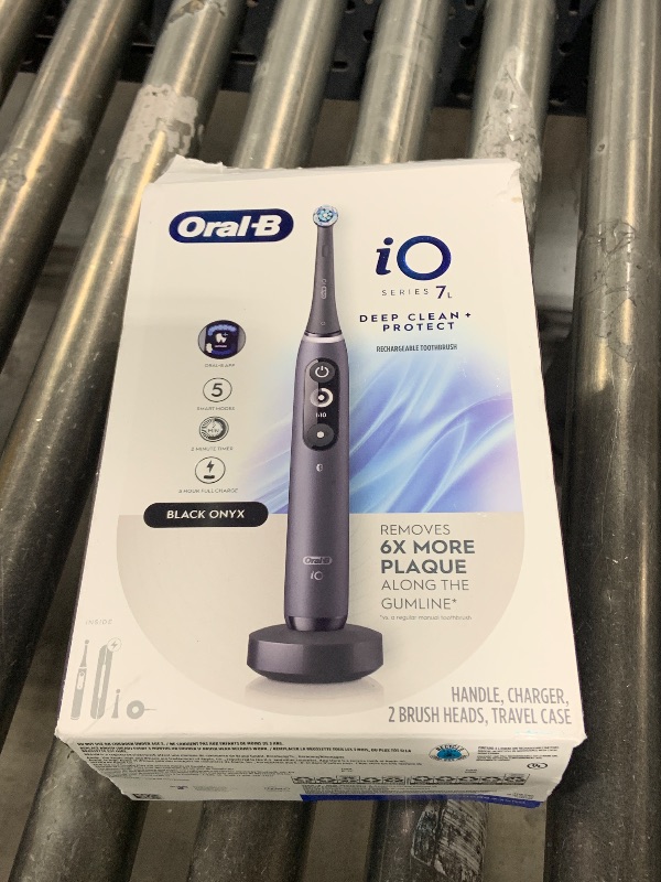 Photo 1 of Oral-B iO Deep Clean + Protect Rechargeable Electric Toothbrush, Black with a iO Series 7 Toothbrush, 2 Replacement Brush Heads, and a Charging Travel Case