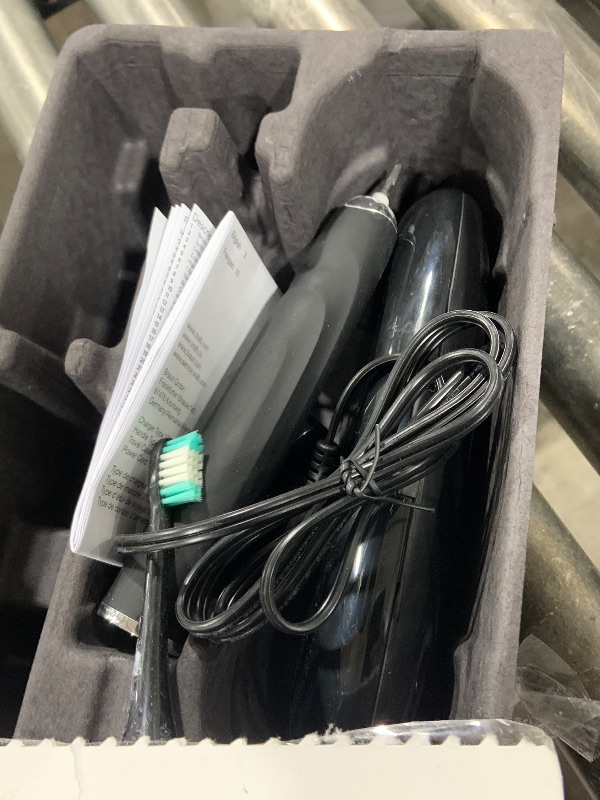 Photo 1 of Oral-B iO Deep Clean + Protect Rechargeable Electric Toothbrush, Black with a iO Series 7 Toothbrush, 2 Replacement Brush Heads, and a Charging Travel Case