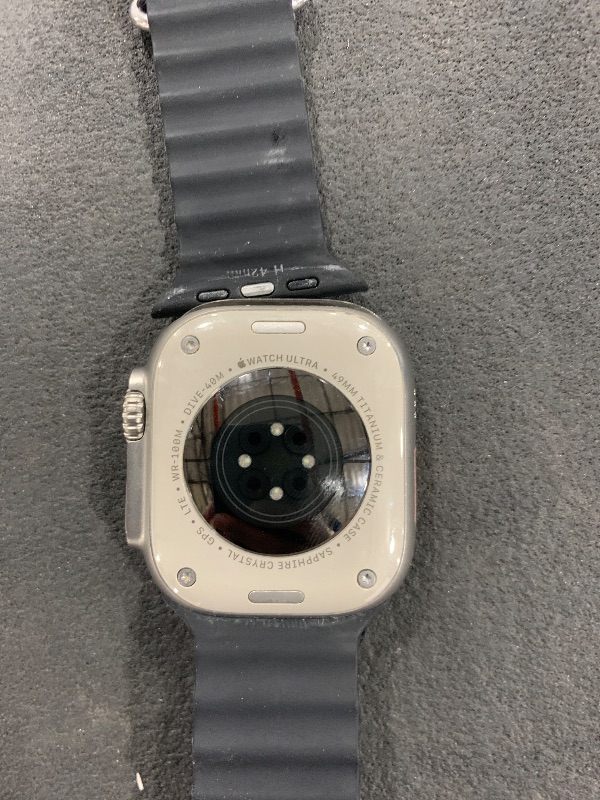 Photo 1 of Apple Watch Ultra [GPS + Cellular 49mm] Titanium Case with Midnight Ocean Band, One Size (Renewed Premium)