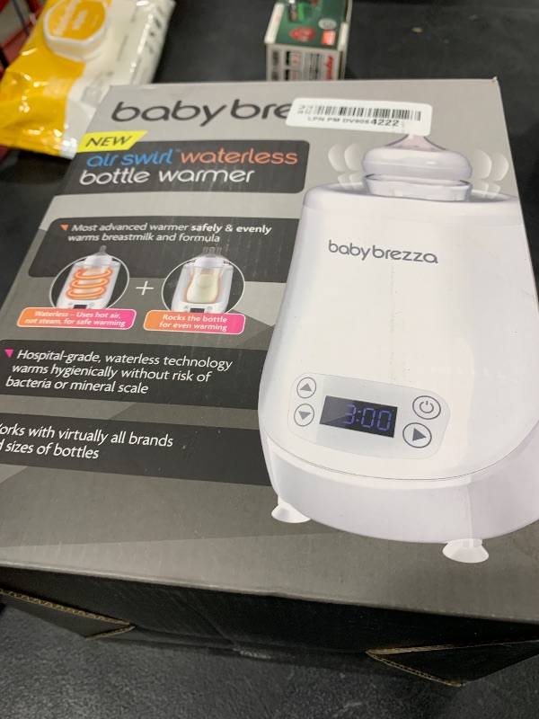 Photo 1 of Baby Brezza AirSwirl Waterless Baby Bottle Warmer - Safely Warm Breastmilk + Formula - Bottles Stay Dry + Nutrients are Protected - Works with Nearly All Bottles