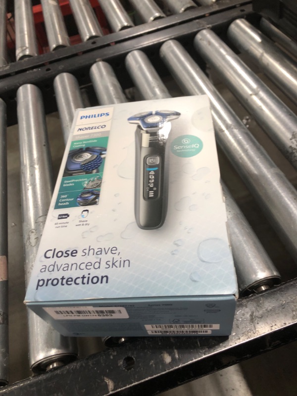 Photo 1 of Philips Norelco Shaver 7300, Rechargeable Wet & Dry Electric Shaver with SenseIQ Technology, Pop-up Trimmer, Charging Stand, Click-on Nose Trimmer, & Travel Case, S7887/92