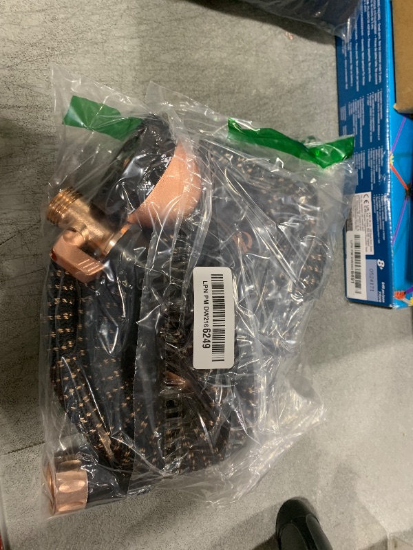 Photo 1 of Pocket Hose Copper Bullet Expandable Garden Hose 25 FT w/10 Pattern Thumb Spray Nozzle AS-SEEN-ON-TV 650psi 3/4 in Patented Lead-Free Ultra-Lightweight Solid Copper Anodized Aluminum Fittings No-Kink
