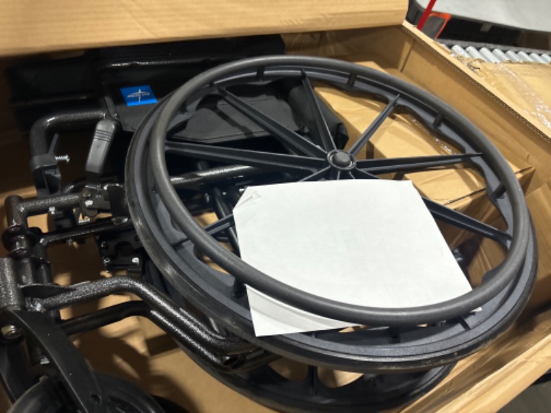 Photo 1 of Medline Comfortable Folding Wheelchair with Swing-Back, Desk-Length Arms and Elevating Footrests, 18”W x 16”D Seat