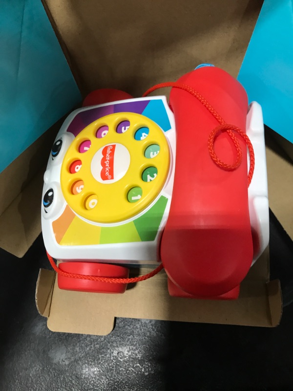 Photo 1 of Fisher-Price Toddler Pull Toy Chatter Telephone Pretend Phone with Rotary Dial and Wheels for Walking Play Ages 1+ years