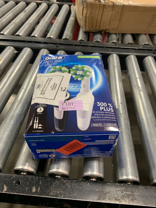 Photo 1 of Oral-B Pro 1000 CrossAction Electric Toothbrush, Black and White, 2 Count