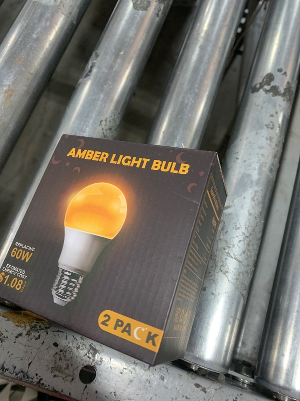 Photo 1 of DALUXshop Amber Sleep Light Bulbs, Blue Light Blocking, A19 9W(60 Watt Equivalent) Dim Light Bulbs for Lamp, 1800K Warm Light Bulb, E26 for Healthy Sleep, Bedroom, Kids Room, 2 Pack