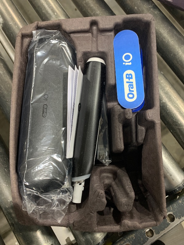 Photo 1 of Oral-B iO Deep Clean + Protect Rechargeable Electric Toothbrush, Black with a iO Series 7 Toothbrush, 2 Replacement Brush Heads, and a Charging Travel Case