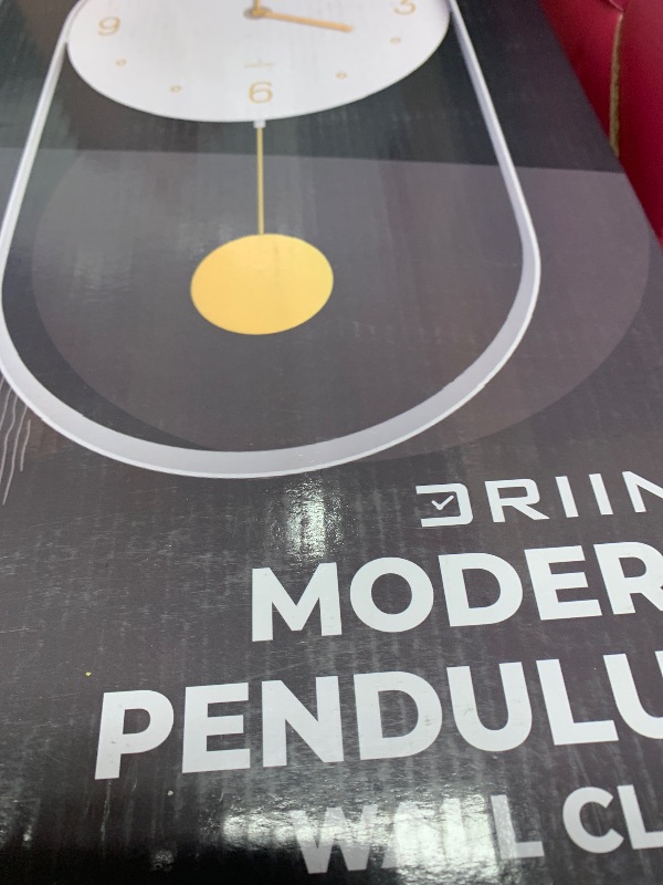 Photo 1 of Driini Modern Pendulum Wall Clock - Decorative and Unique Metal Frame, with 8 Inch Face - Contemporary, Minimalist Design, with Silent Non Ticking Operation - Includes Both White and Gold Pendelum