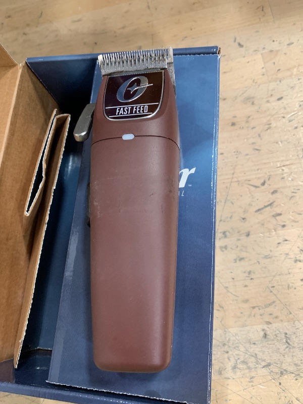 Photo 1 of Oster Professional Cordless Hair Clippers, Fast Feed for Barbers and Hair Cutting with Detachable Blade, Burgundy