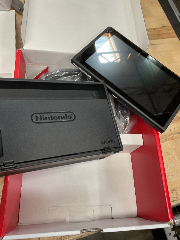 Photo 1 of Nintendo Switch with Neon Blue & Neon Red Joy-Con