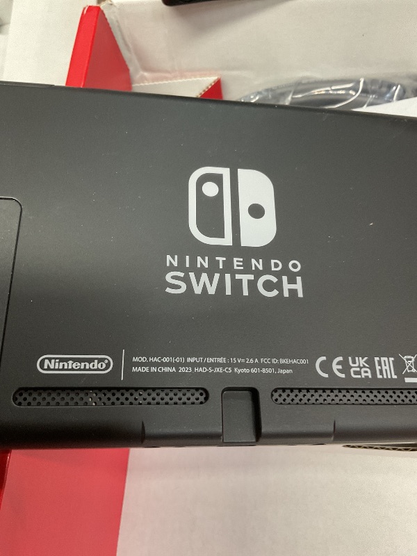 Photo 1 of * NO CONTROLLERS** Nintendo Switch with Neon Blue & Neon Red Joy-Con
