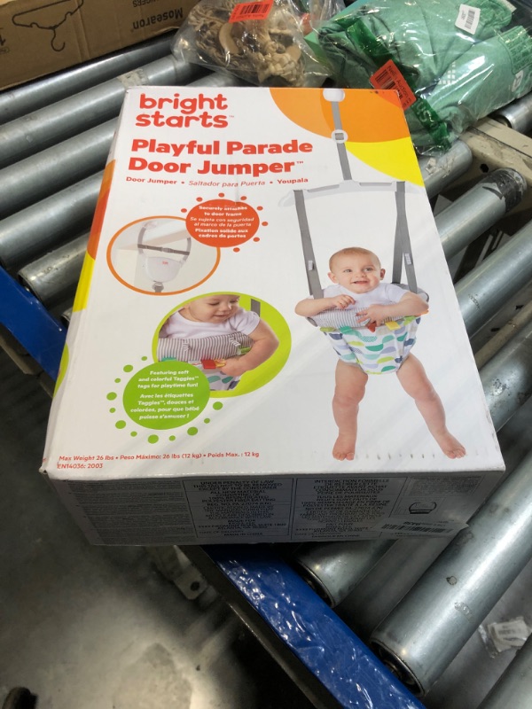 Photo 1 of Bright Starts Playful Parade Door Jumper for Baby with Adjustable Strap, 6 Months and Up, Max Weight 26 lbs. 