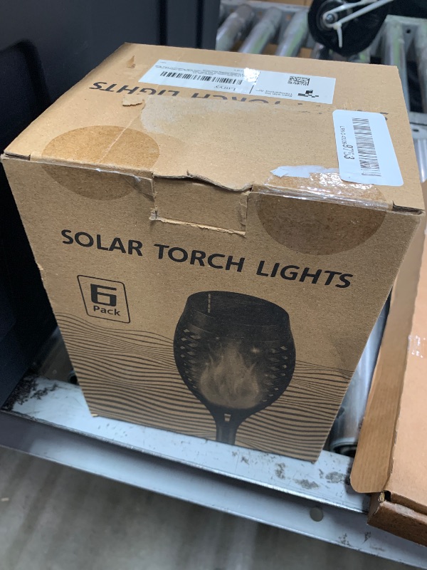 Photo 1 of **PARTIALLY FUNCTIONAL** Flickering Flame Solar Lights, 4 Pack Tiki Torch Lights for Outside, LED Waterproof Yard Solar Lights for Outside Garden Patio Pathway