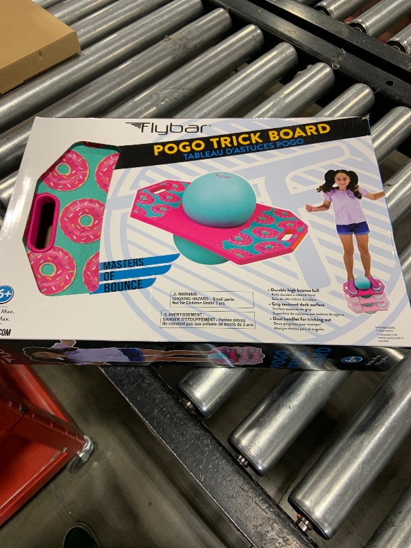 Photo 2 of Flybar Pogo Trick Ball for Kids, Trick Bounce Board for Boys and Girls Ages 6+, Up to 160 lbs, Includes Pump, Easy to Carry Handle, Durable Plastic Deck Indoor, Outdoor Toy Pogo Jumper (Donut)